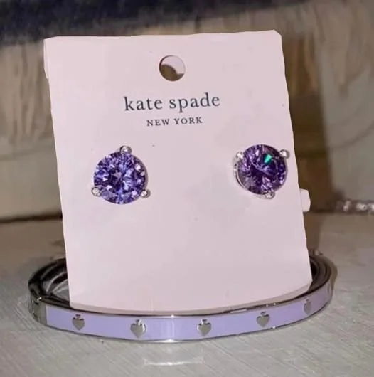 Kate Spade purple stud earrings with matching bangle.