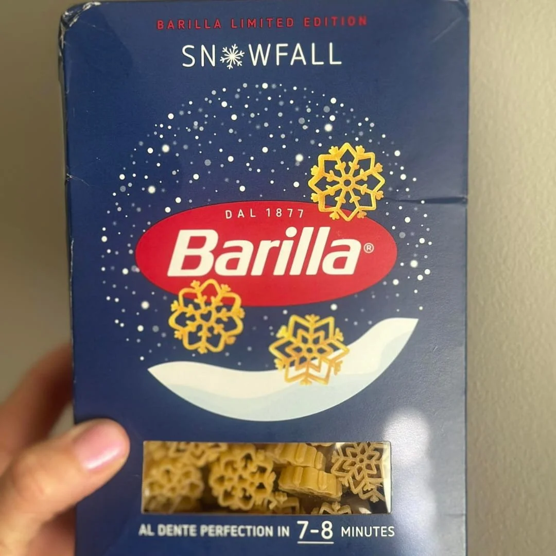 Barilla Limited Edition Snowfall pasta brings festive cheer with snowflake-shaped pasta in a beautifully designed blue box adorned with golden snowflakes.