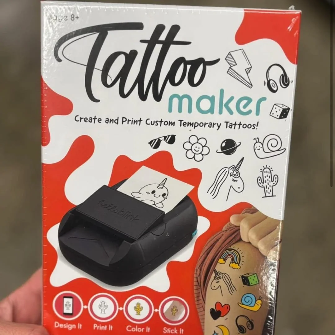 Tattoo Maker Kit for kids aged 8+, allowing them to design, print, color, and apply custom temporary tattoos. Includes a compact printer, fun tattoo designs, and easy-to-follow steps for creative play.