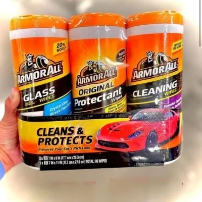 3-pack of Armor All car cleaning wipes, including Glass, Original Protectant, and Cleaning Wipes, with orange lids and a bold Cleans & Protects label, featuring a red sports car on the packaging.