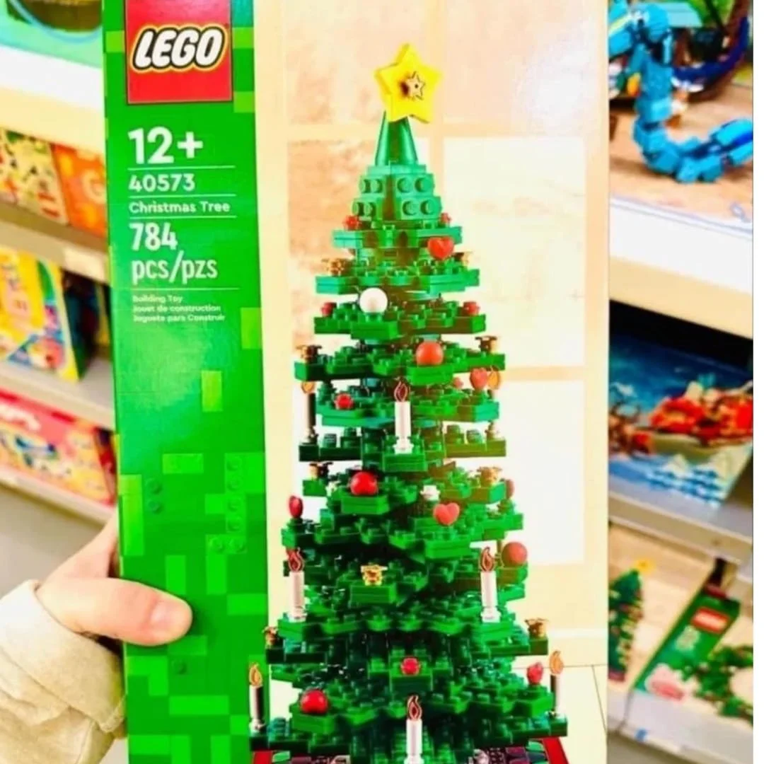 LEGO Christmas Tree set box with a detailed tree model, including ornaments, candles, and a star, perfect for holiday building.