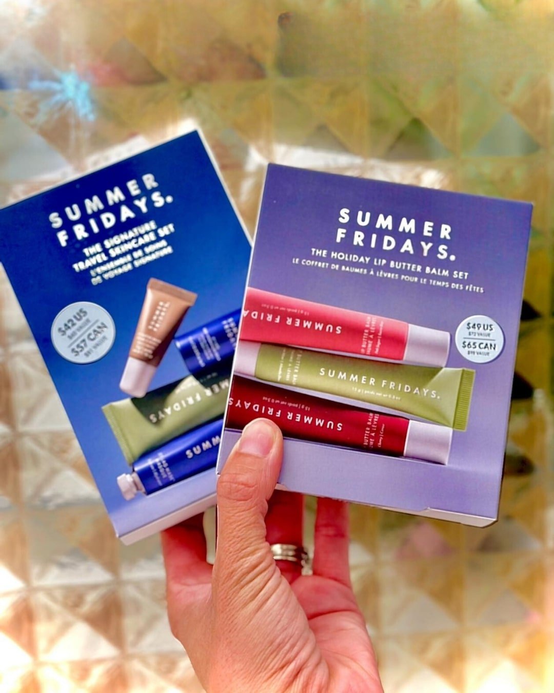 Summer Fridays Signature Travel Skincare Set and Holiday Lip Butter Balm Set, featuring travel-sized skincare and lip balms in festive packaging.