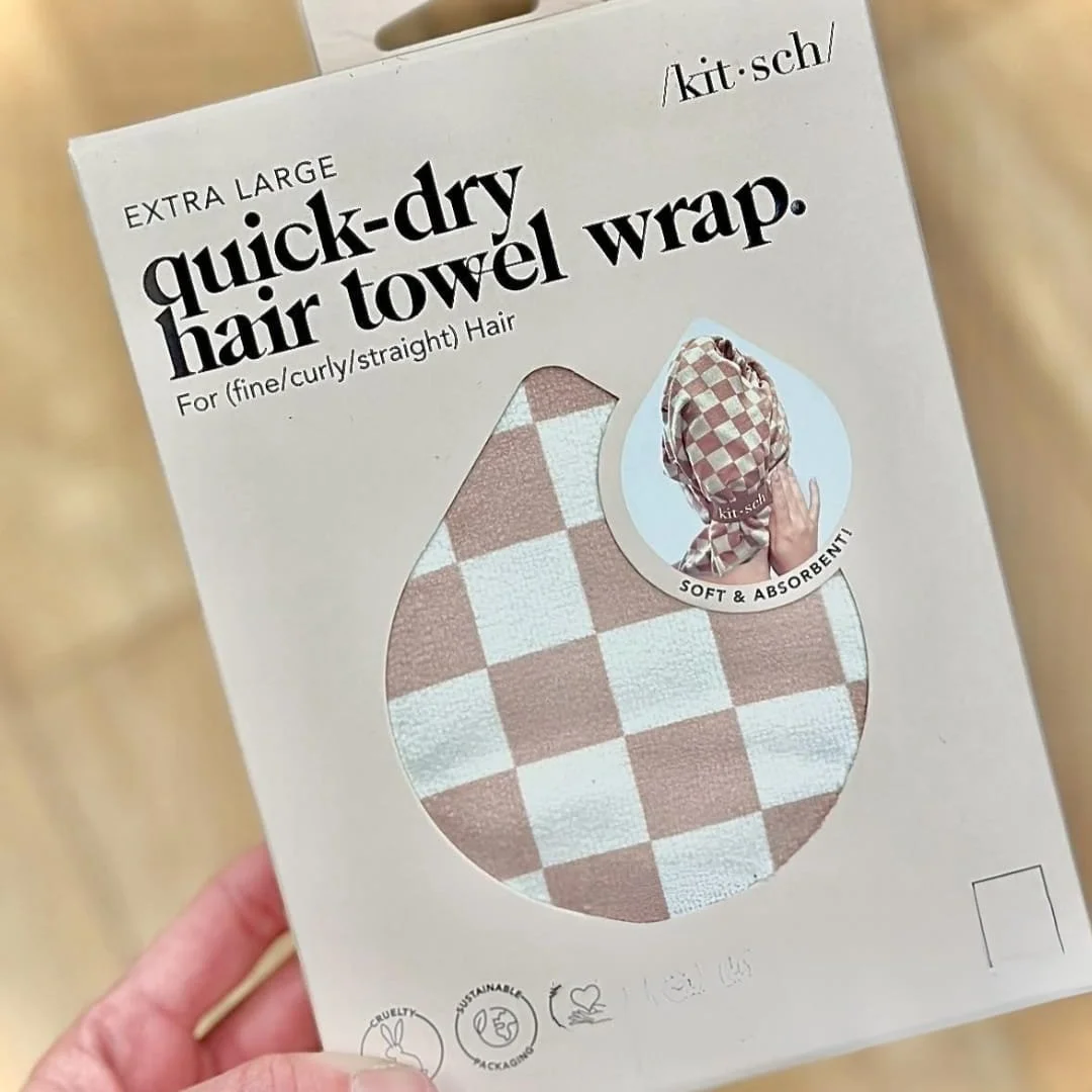 Kitsch extra-large quick-dry hair towel wrap with a light brown and white checkerboard pattern, shown in sustainable and cruelty-free packaging, suitable for all hair types.