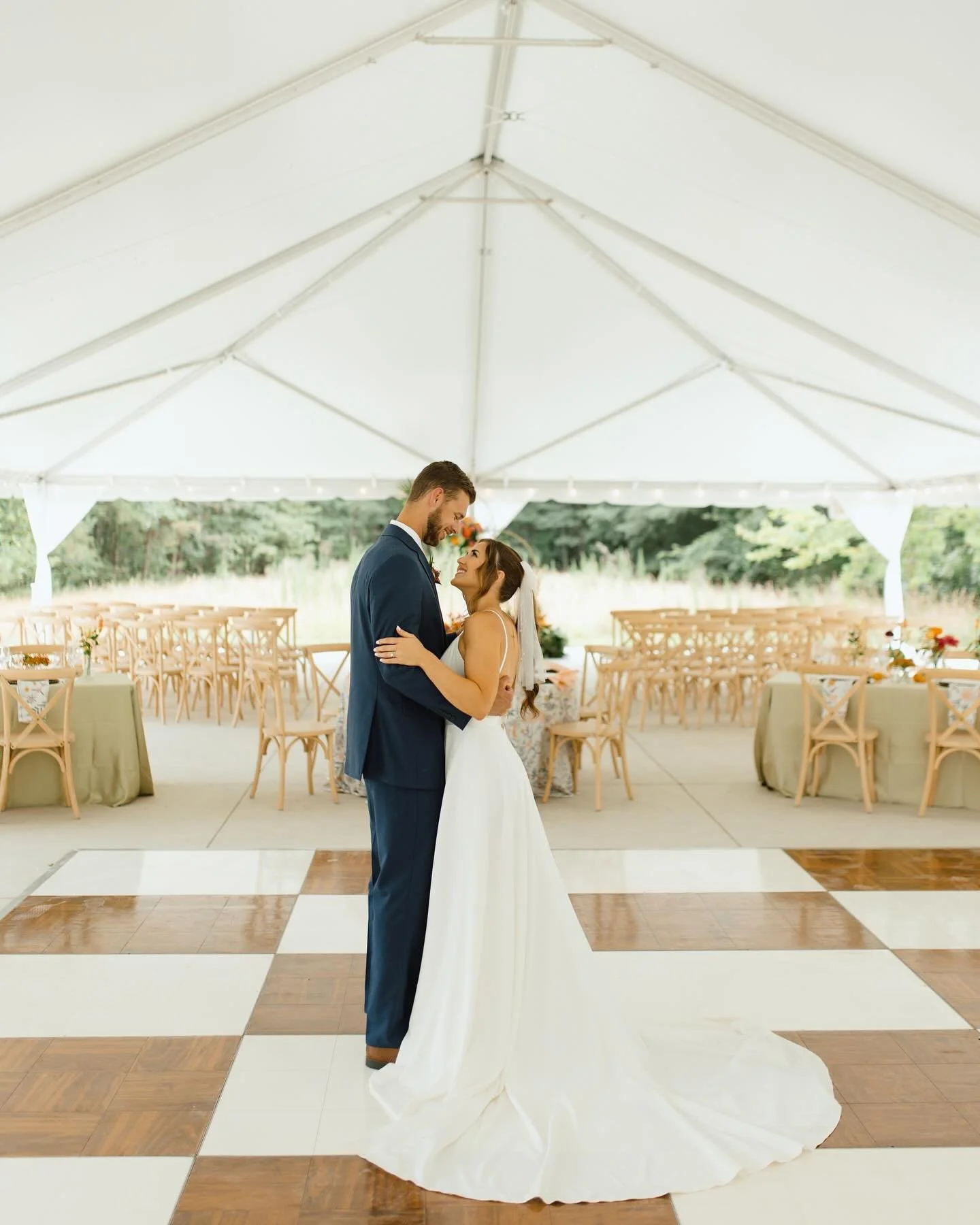 Share your romantic first dance under our beautiful white tented reception area. 💃 

The Baucom House reception area features a large white tent, draped with warm white market lights and a smooth concrete surface. ✨ 

With ample room for 250 guests,