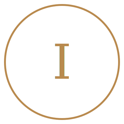 Close-up of a circular emblem with a black background, gold border, and the letter 'I' in the center.