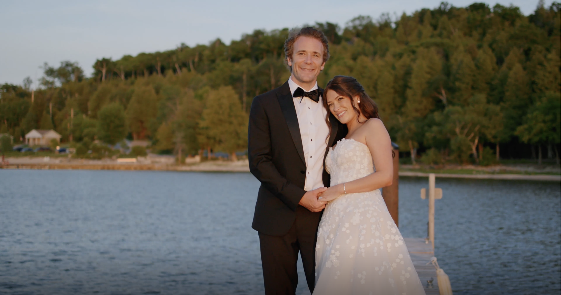 Newlywed couple standing on the shore of Door County