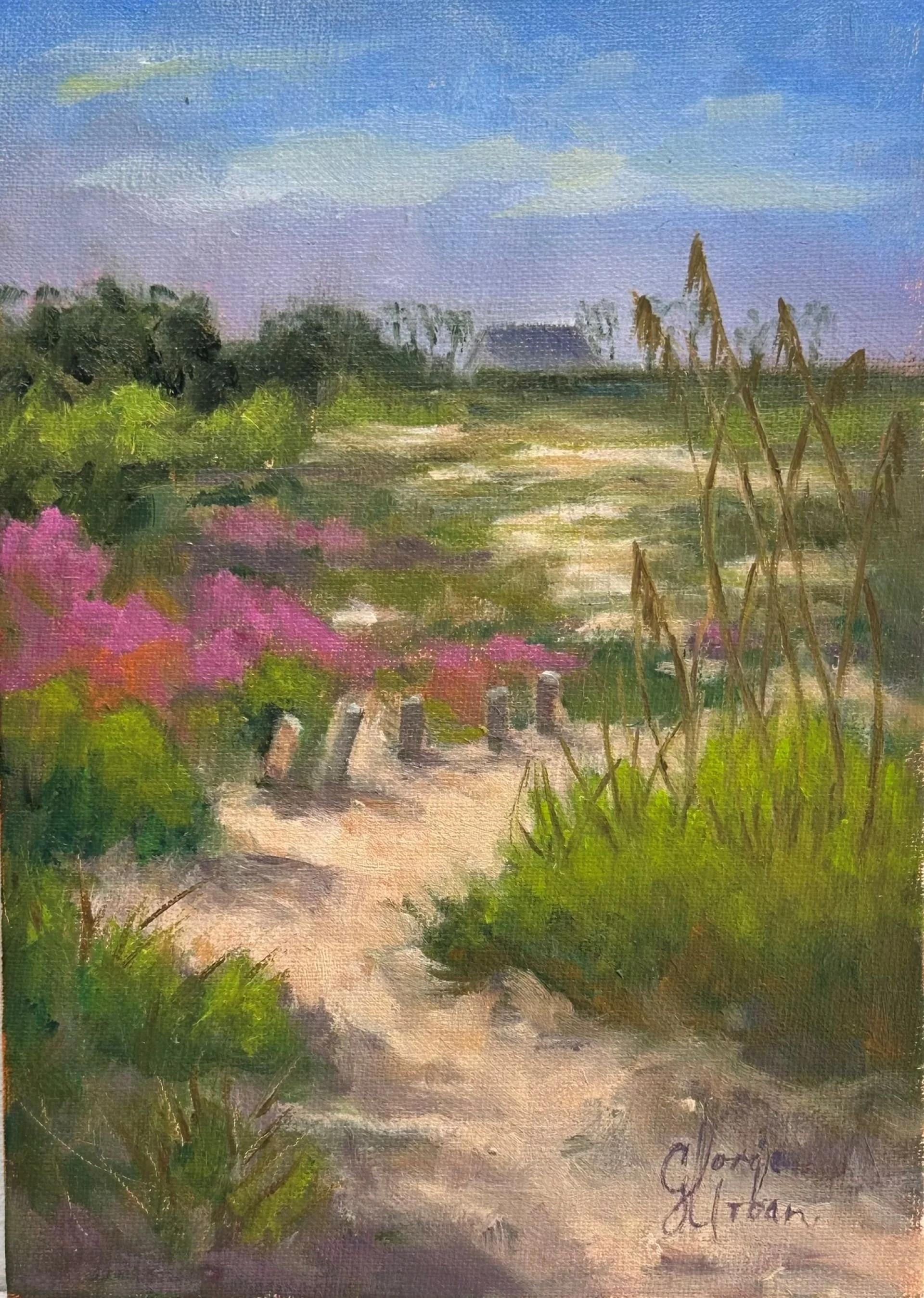 A landscape painting of a sandy path winding through green grass and pink flowering bushes, with tall grasses on the right and a distant house with trees under a blue sky with clouds.