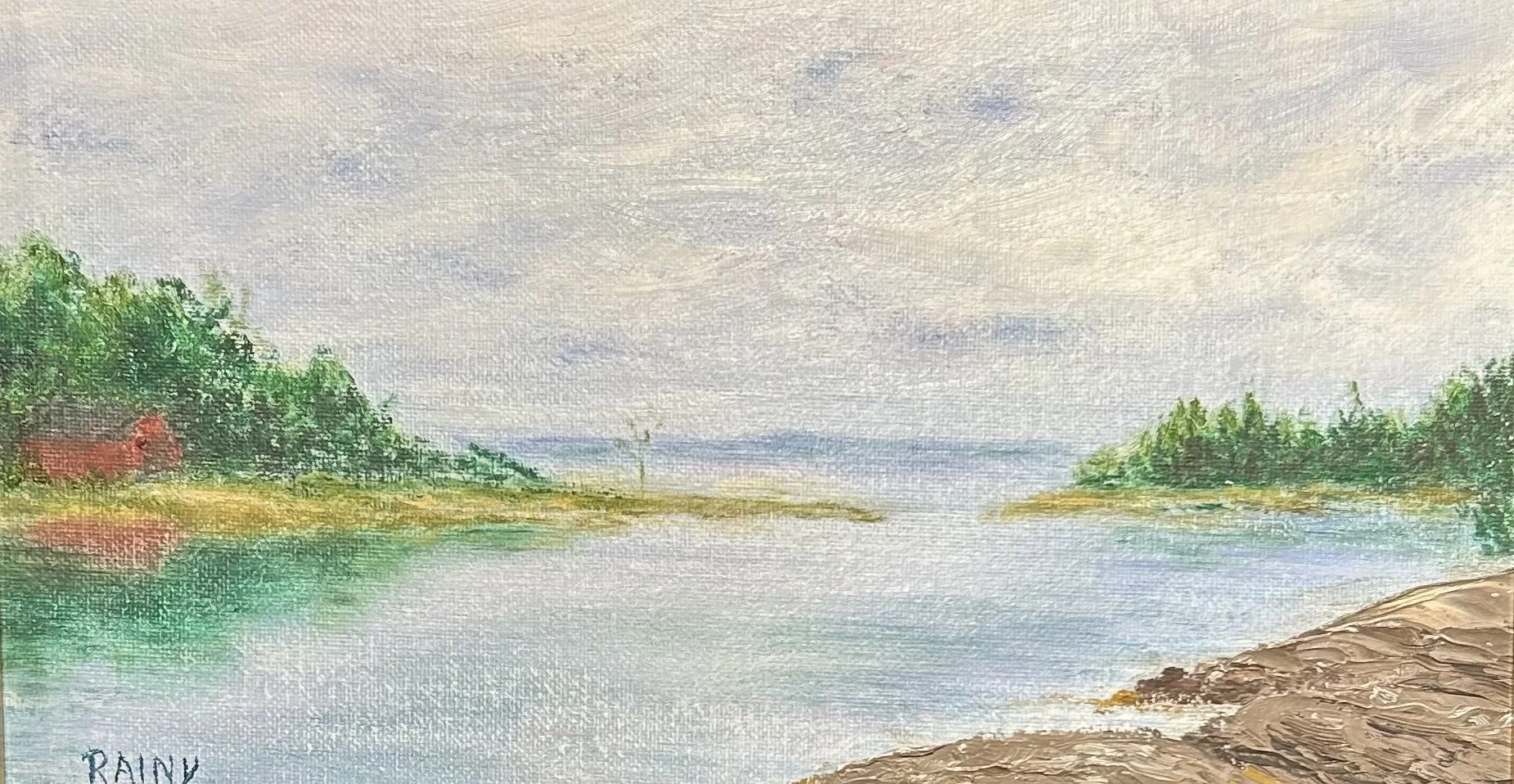 Waterfront landscape scene with a cloudy sky, trees on both sides, a calm river, and rocks in the foreground. The word 'RAINY' is written on the lower left corner.