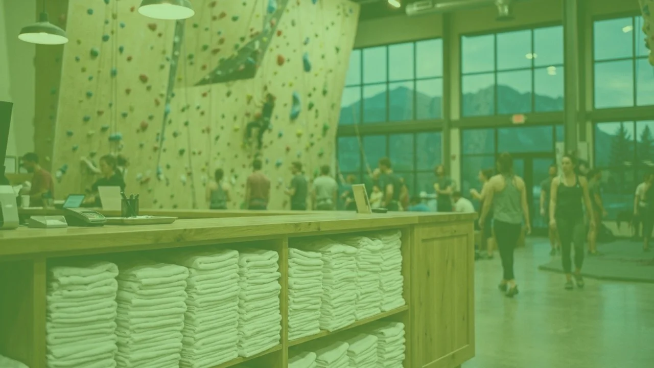 Clean towel station at a Colorado climbing gym during the evening rush, supplied by fitness center laundry