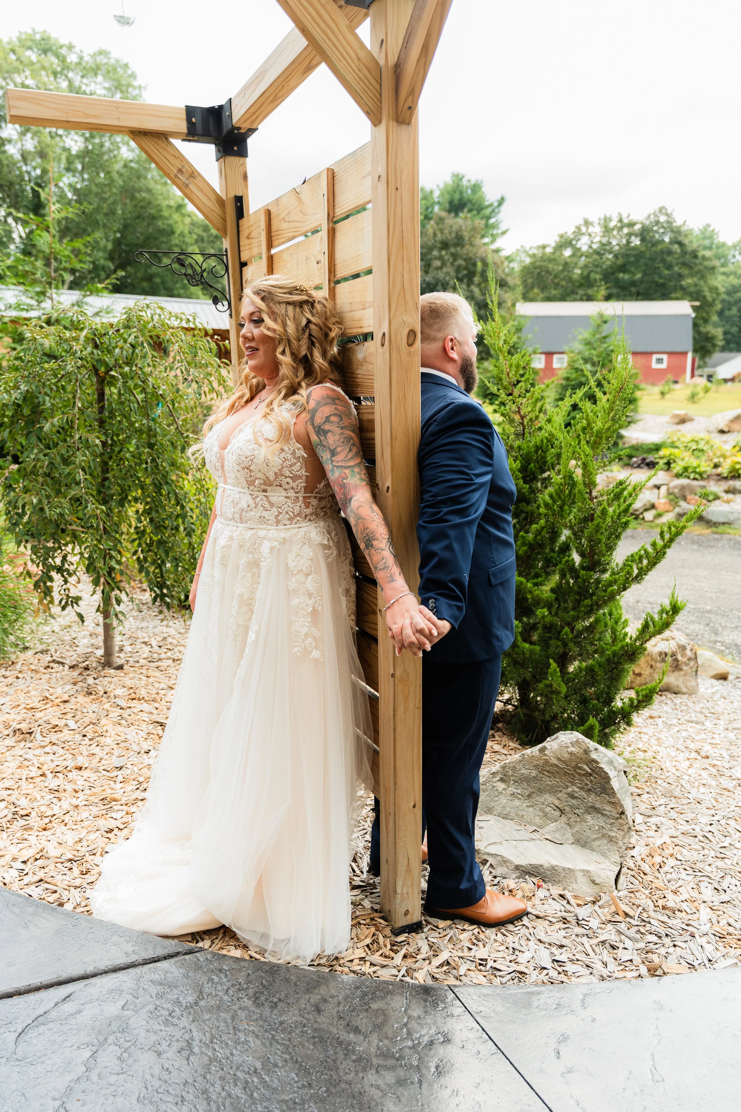 A sweet first touch with one of our Connecticut couples, sharing a quiet moment together before walking down the aisle at Evergreen Farms. Coordinated by Small Town Moments.

Photo by Rise to It Productions
risetoitproductions.com