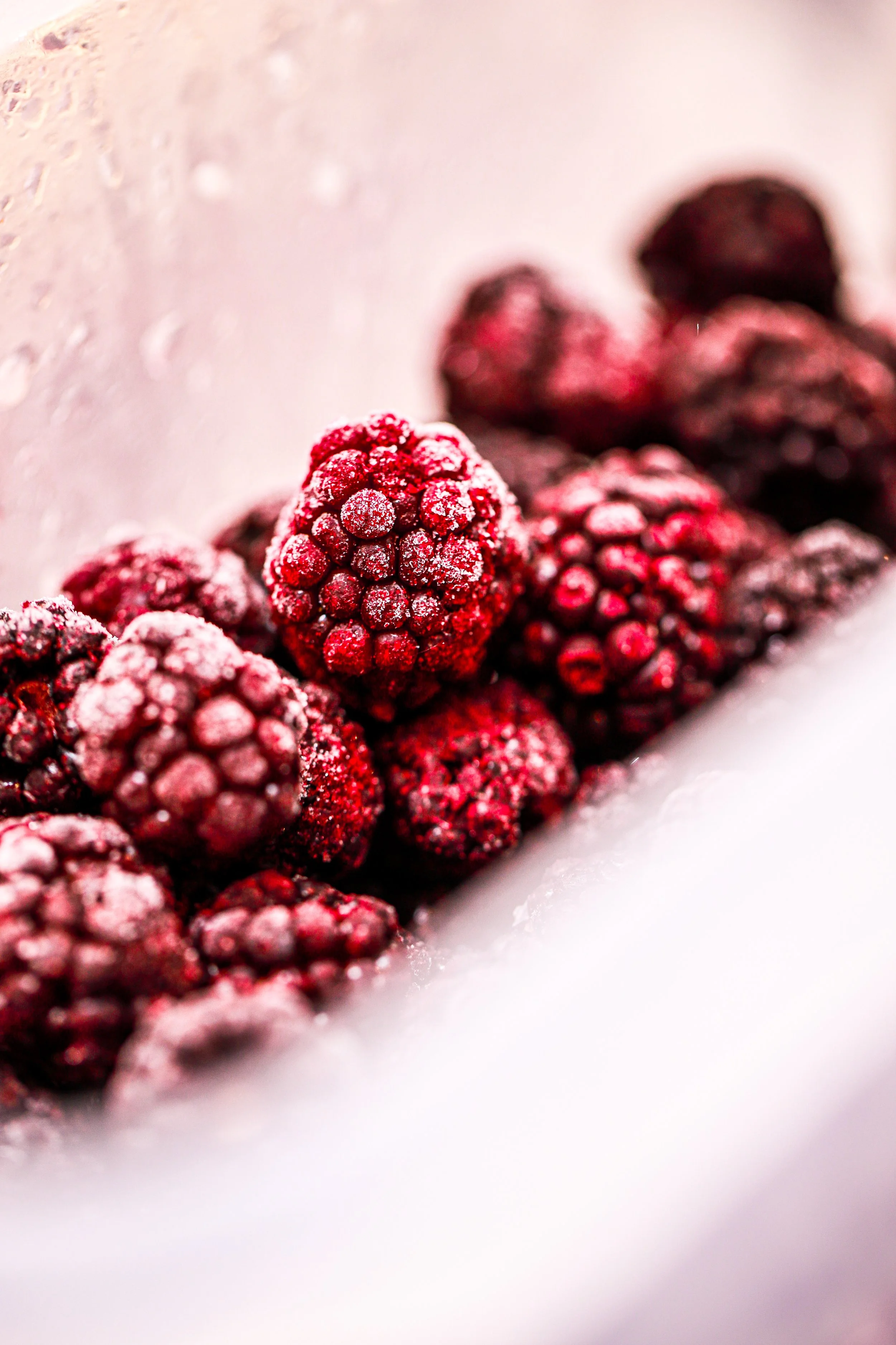 Close-up of frozen blackberries with frost crystals