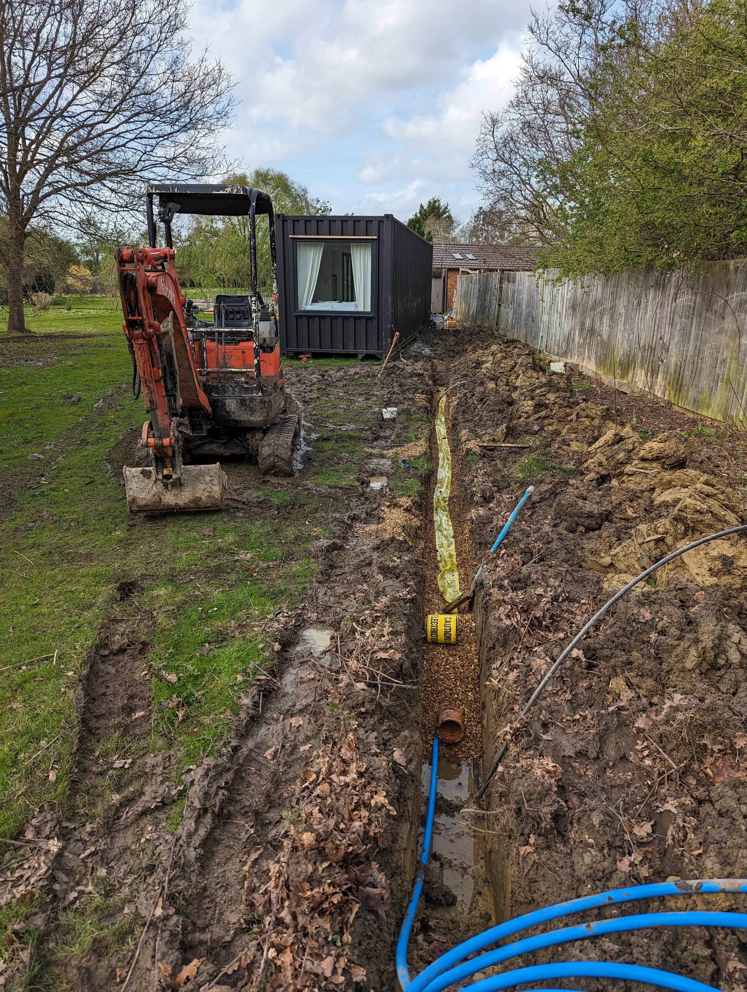 underground drainage being installed for container building in bedford