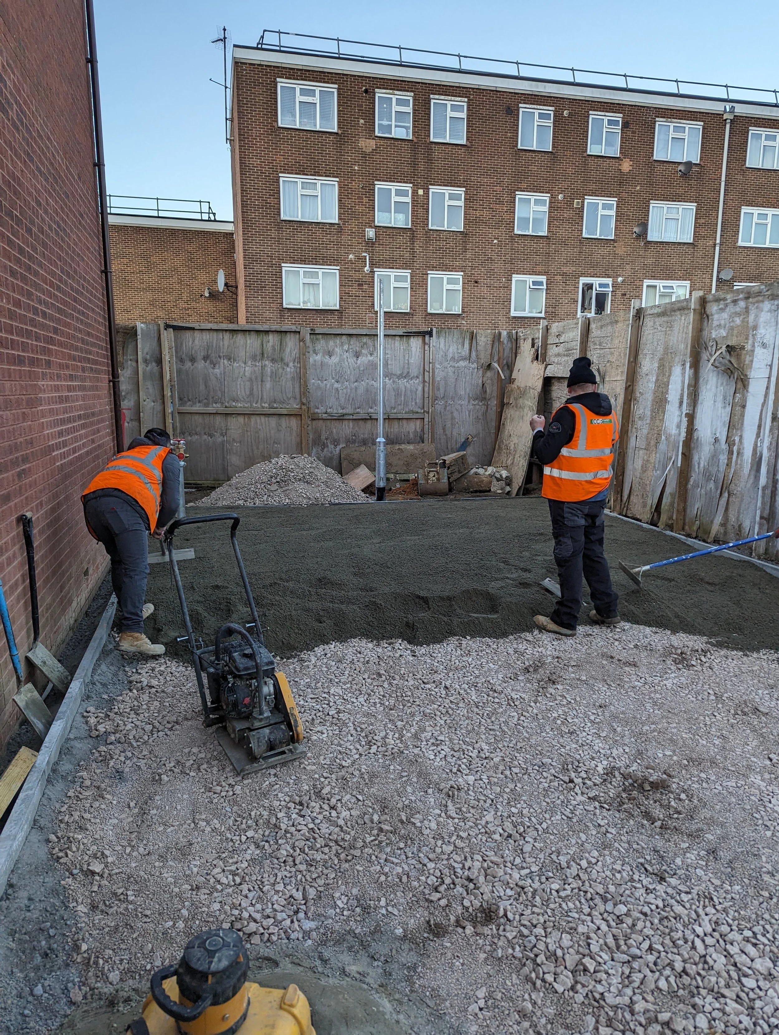 permeable concrete base being laid tarmac car park for new build development east london essex