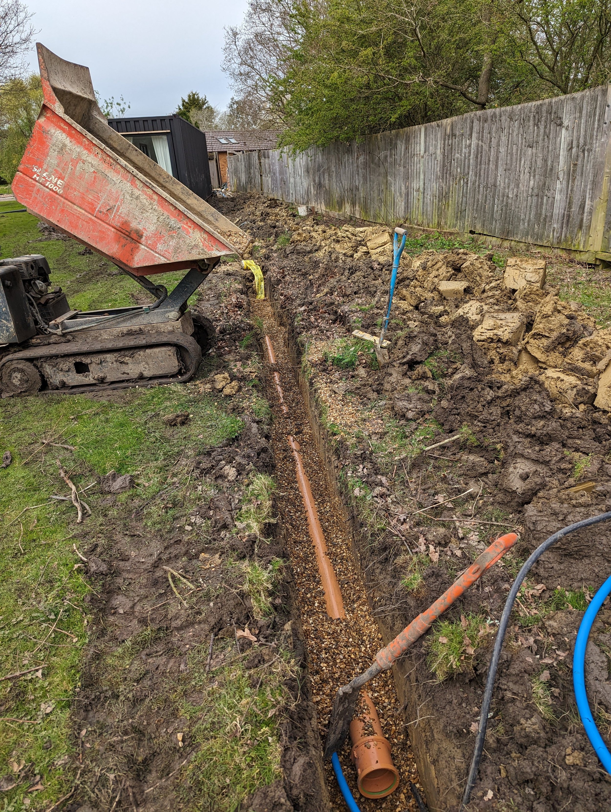 underground drainage being installed for container building in bedford