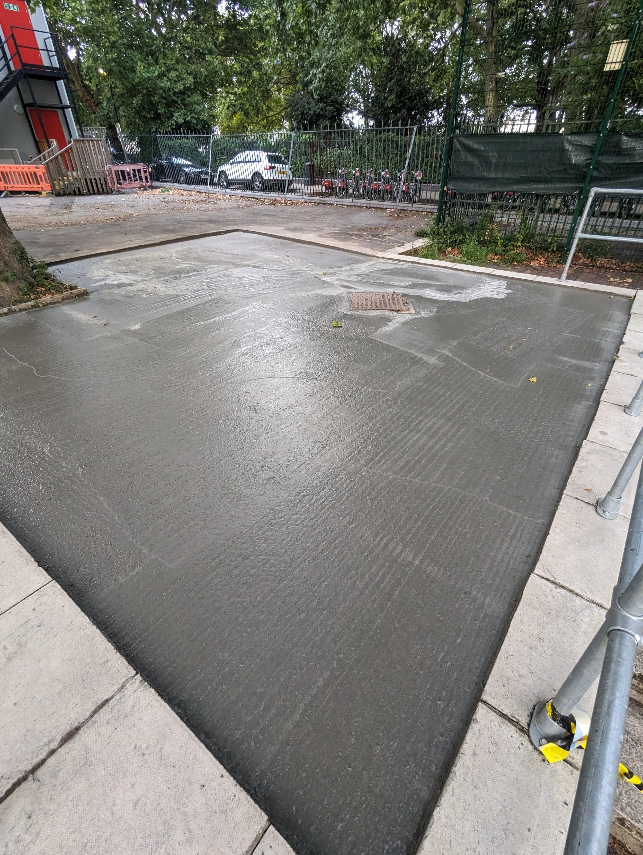 reinforced concrete base laid for tarmac repair at school isle of dogs east london