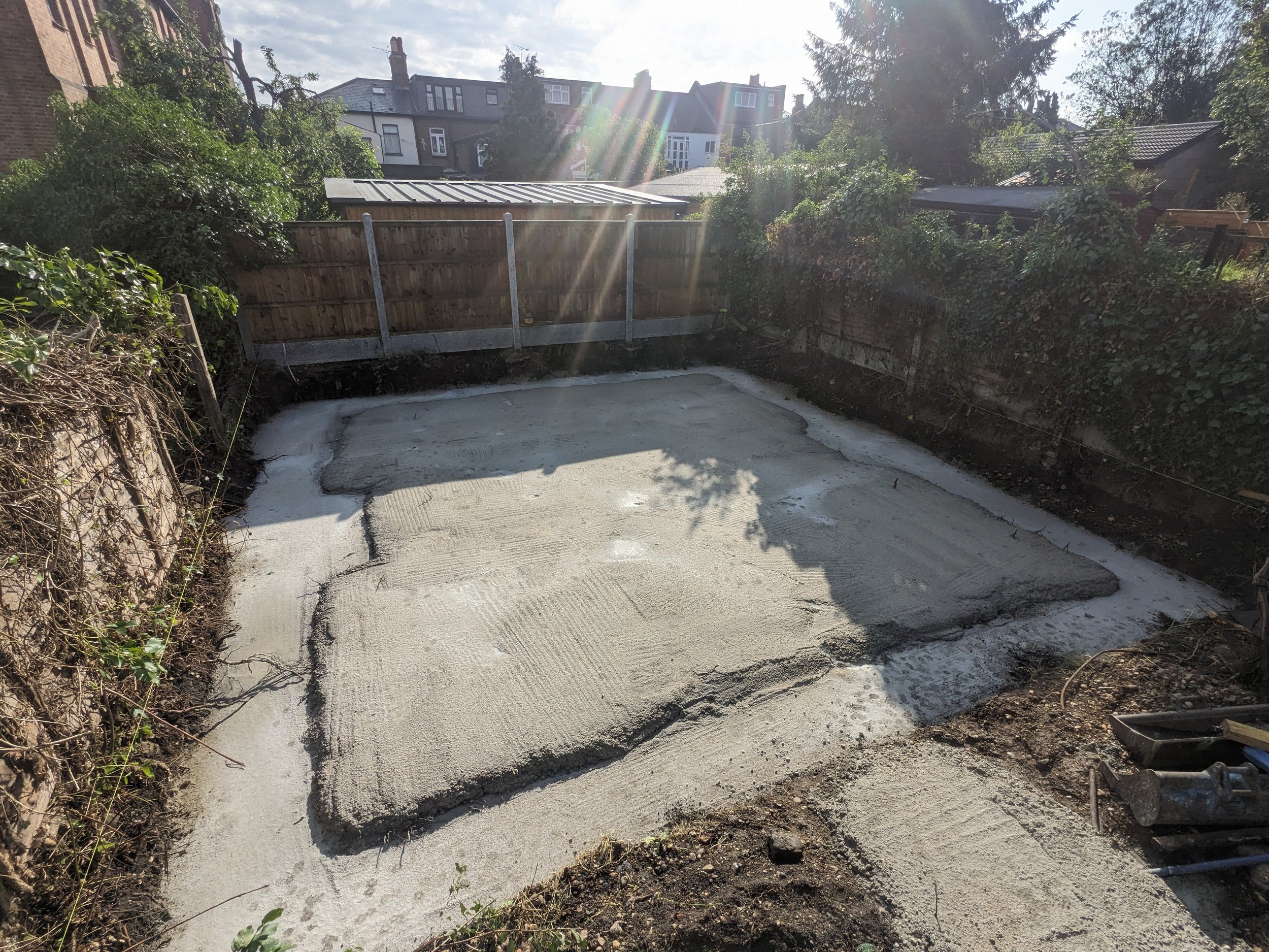 foundations and concrete blinding poured for yoga studio in east london