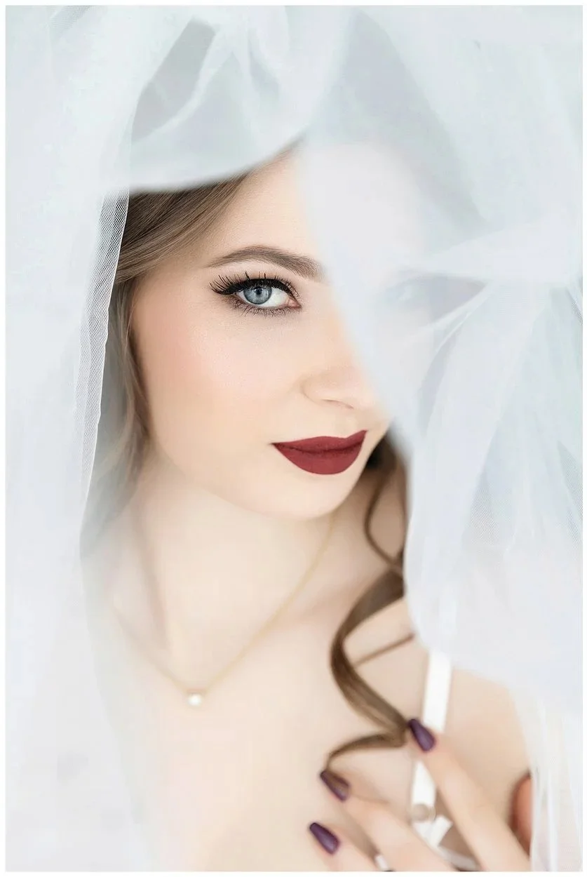 Elegant bridal boudoir portrait of a confident woman during a luxury photography session