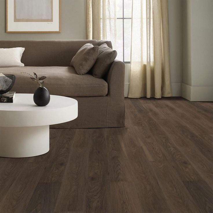 Dark wood like vinyl flooring installation in open concept living room