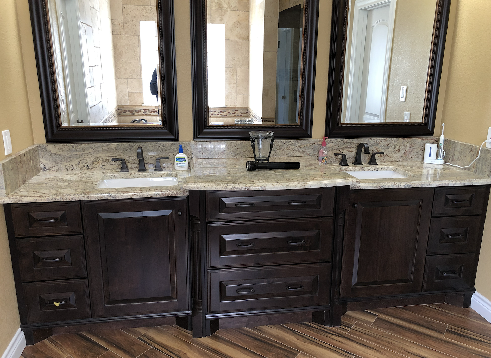 traditional bathroom remodel featuring dark wood custom vanity