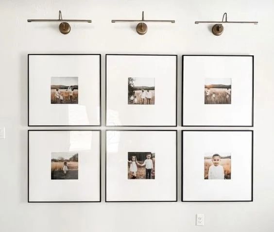 Interior wall lights over family photo gallery