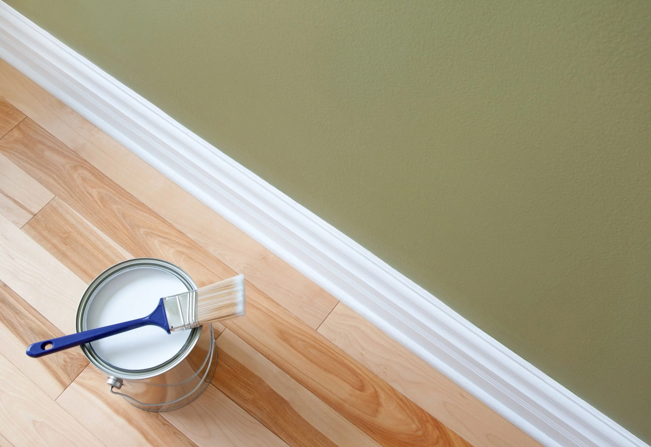 Baseboard painting for a polished and unified finish throughout the room