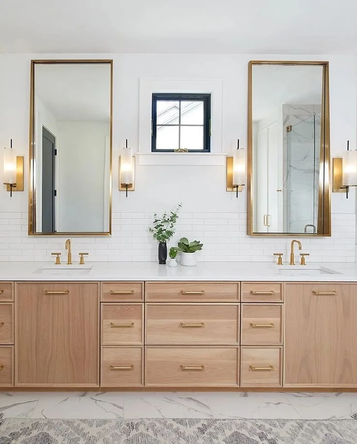 Vanities, showcasing a wood vanity with ample drawers and ceiling-height mirrors that maximize space and light.
