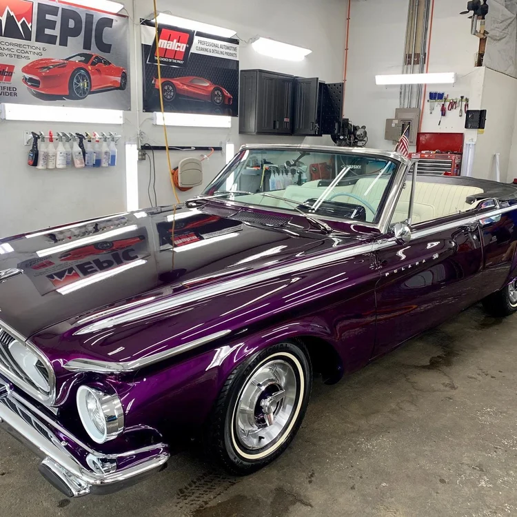 Purple and white ski boat after a full boat detail