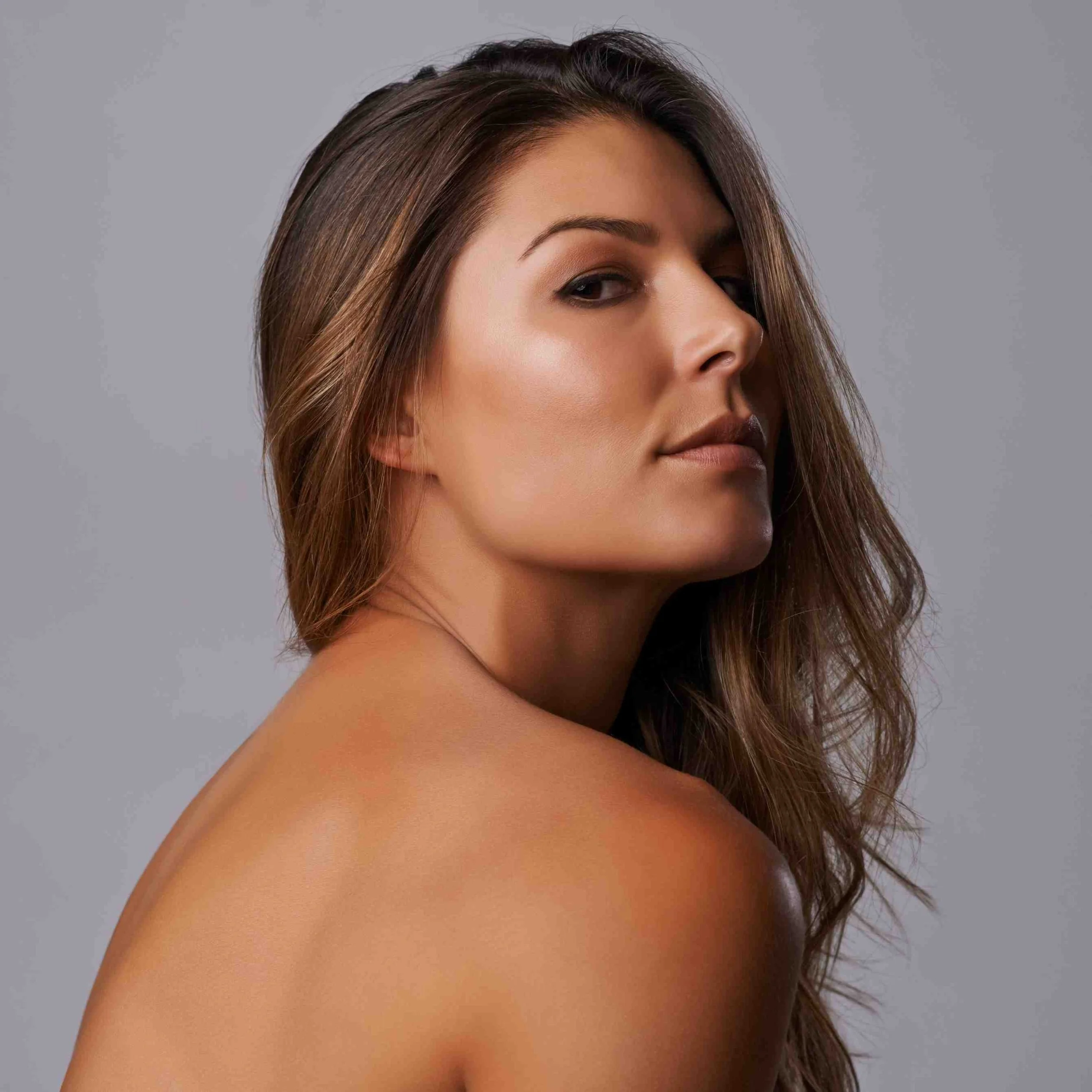 Woman with smooth shoulder skin representing results you can achieve with professional body skincare and back treatments.