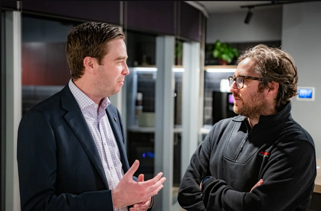 man in suit asking someone about their compliance needs