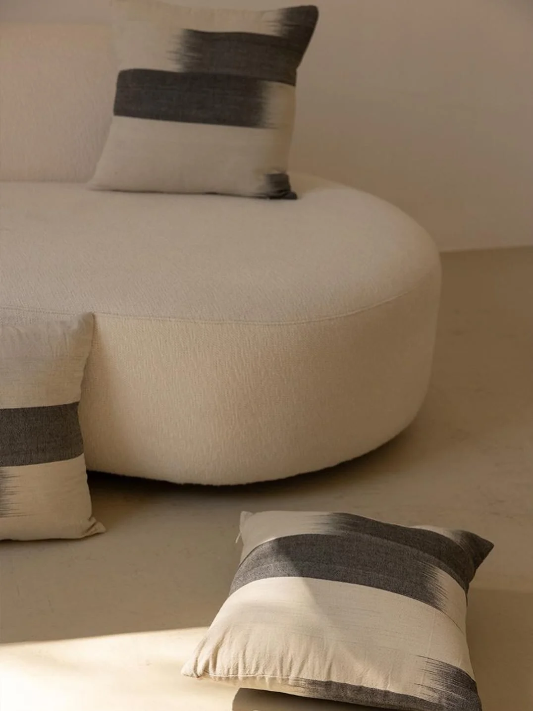 *

Martina cushion &mdash; a quiet layer for the living room.

Handwoven on an antique loom in Bali.
Dyed with plants. Shaped slowly, by many hands.

The weave keeps its small irregularities &mdash;subtle signs of the process that make each piece sli