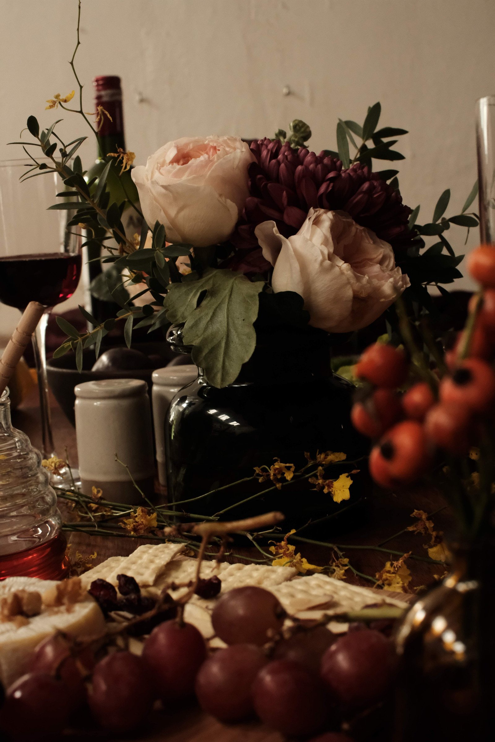 Seasonal graze table with charcuterie, fruit and flowers by Feast with Fiore in Los Angeles.