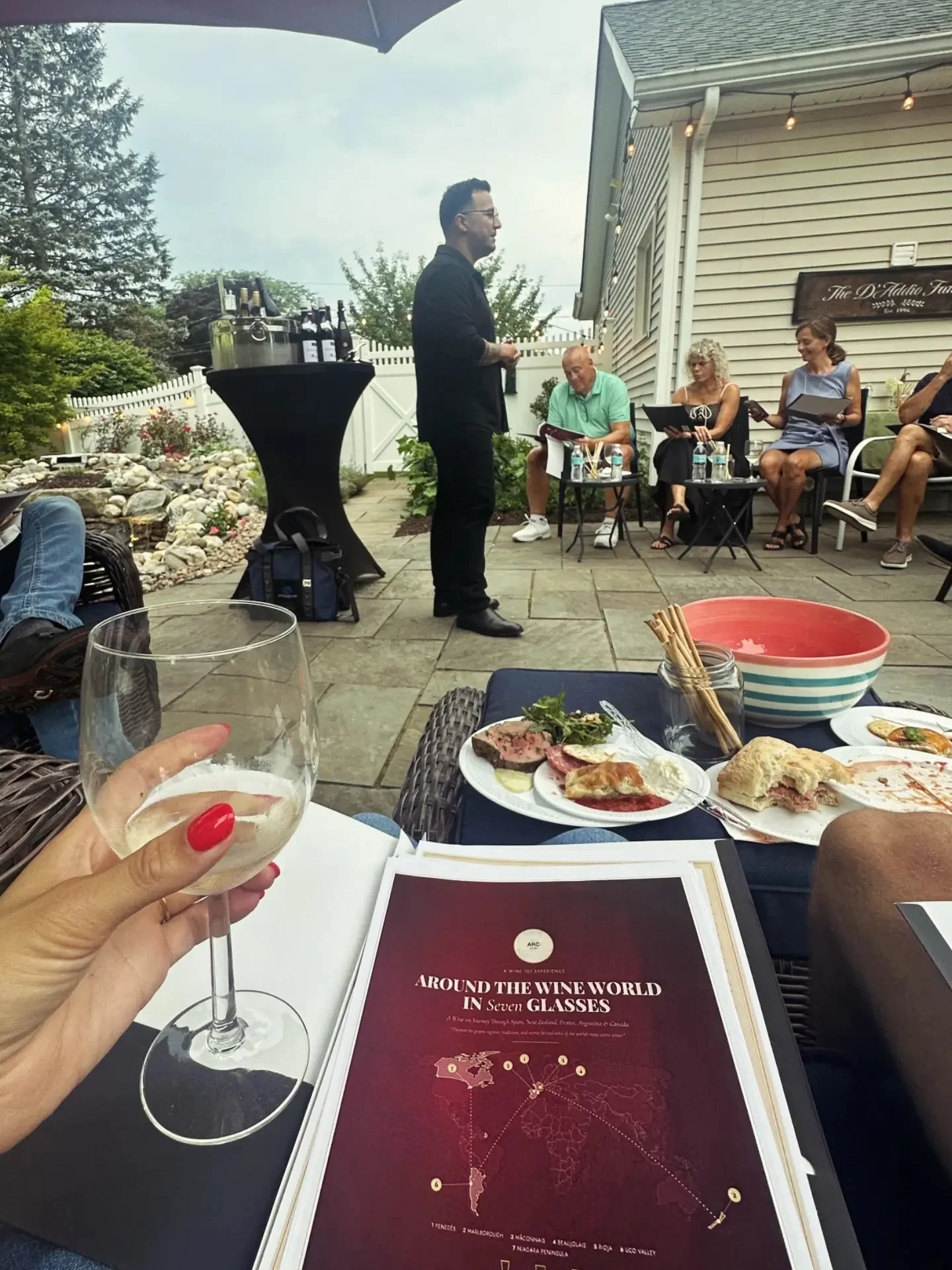 Angel Ramón Crespo presenting wines to guests at an 'Around the Wine World in Seven Glasses' tasting event