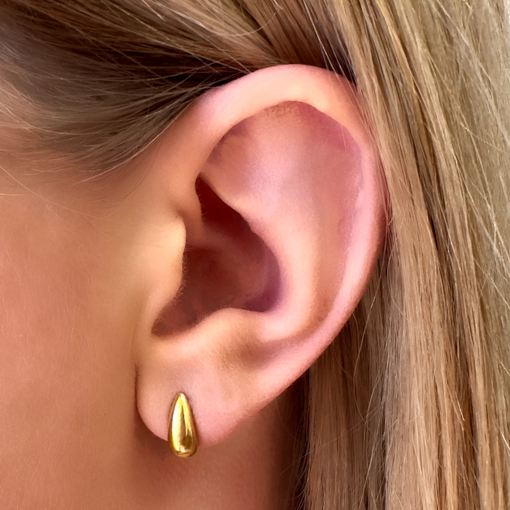 Swift_Stud_Earrings_on_ear.jpg