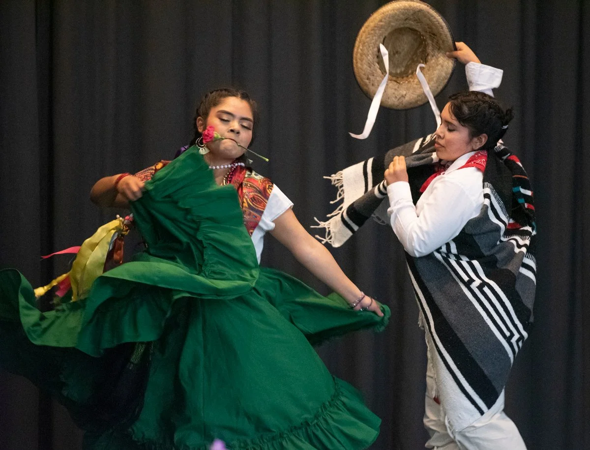  Maritza Sanchez (left) and Yareli Barrera perform the jarabe Mixteco dance on May 22 during the Mixteco Community Celebration at Washington Elementary in Mount Vernon.  