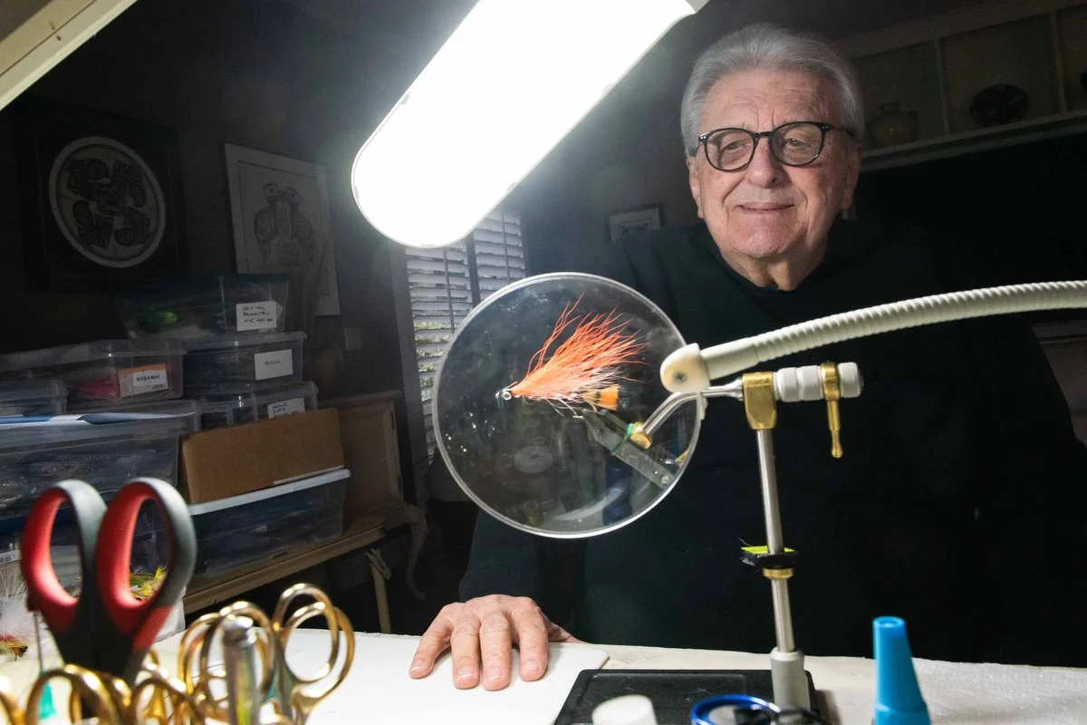 Bill Fairey poses for a portrait at his desk where he ties flies on Oct. 17 in his home in Anacortes. 
