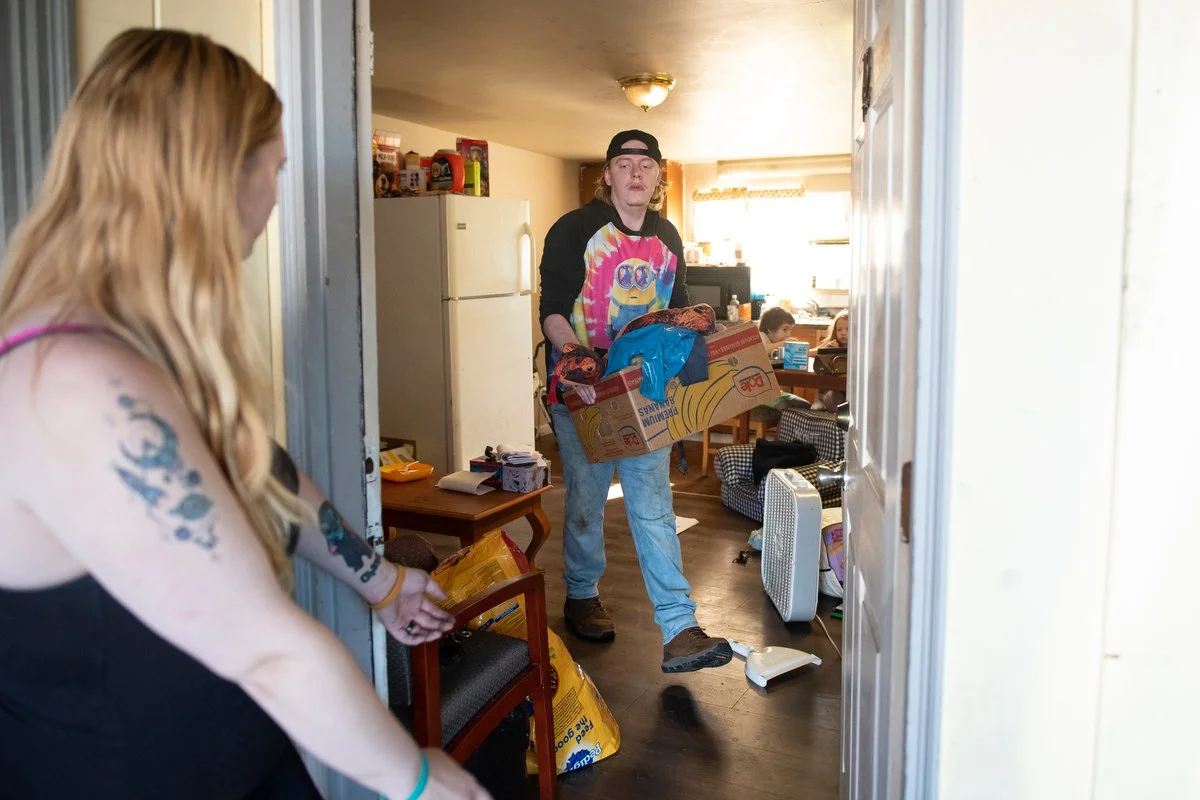  Tristin Lorass (right) and Samantha Gates pack their belongings on Aug. 3 at the Skagit Motel in Sedro-Woolley. The sudden closure of the motel due to a drug contamination left little time for residents to move out.  