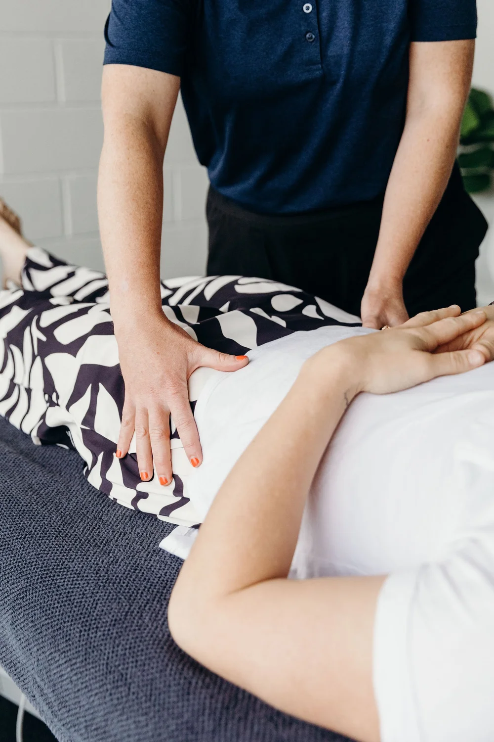Osteopath treating a patient's hip and pelvis at OGOSH