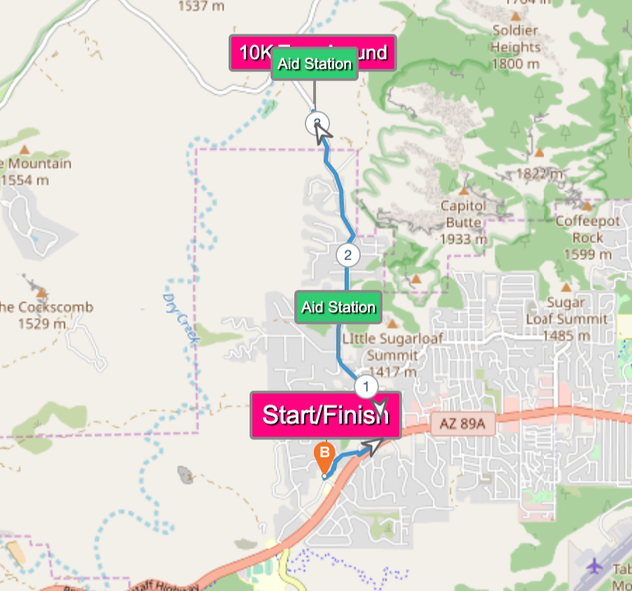 Map showing a trail with start/finish at bottom, two aid stations along the trail, and elevation markers in the surrounding area.