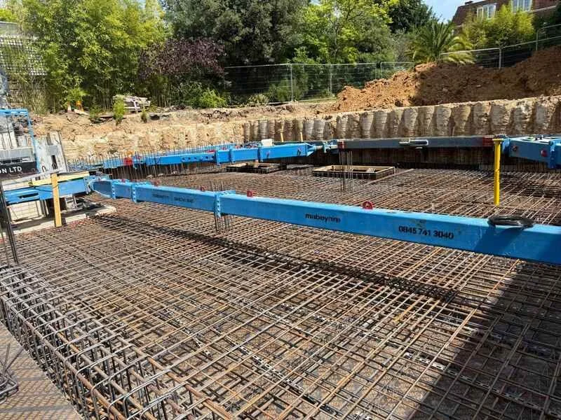 Precision formwork and rebar installation in preparation for concrete slab pour.