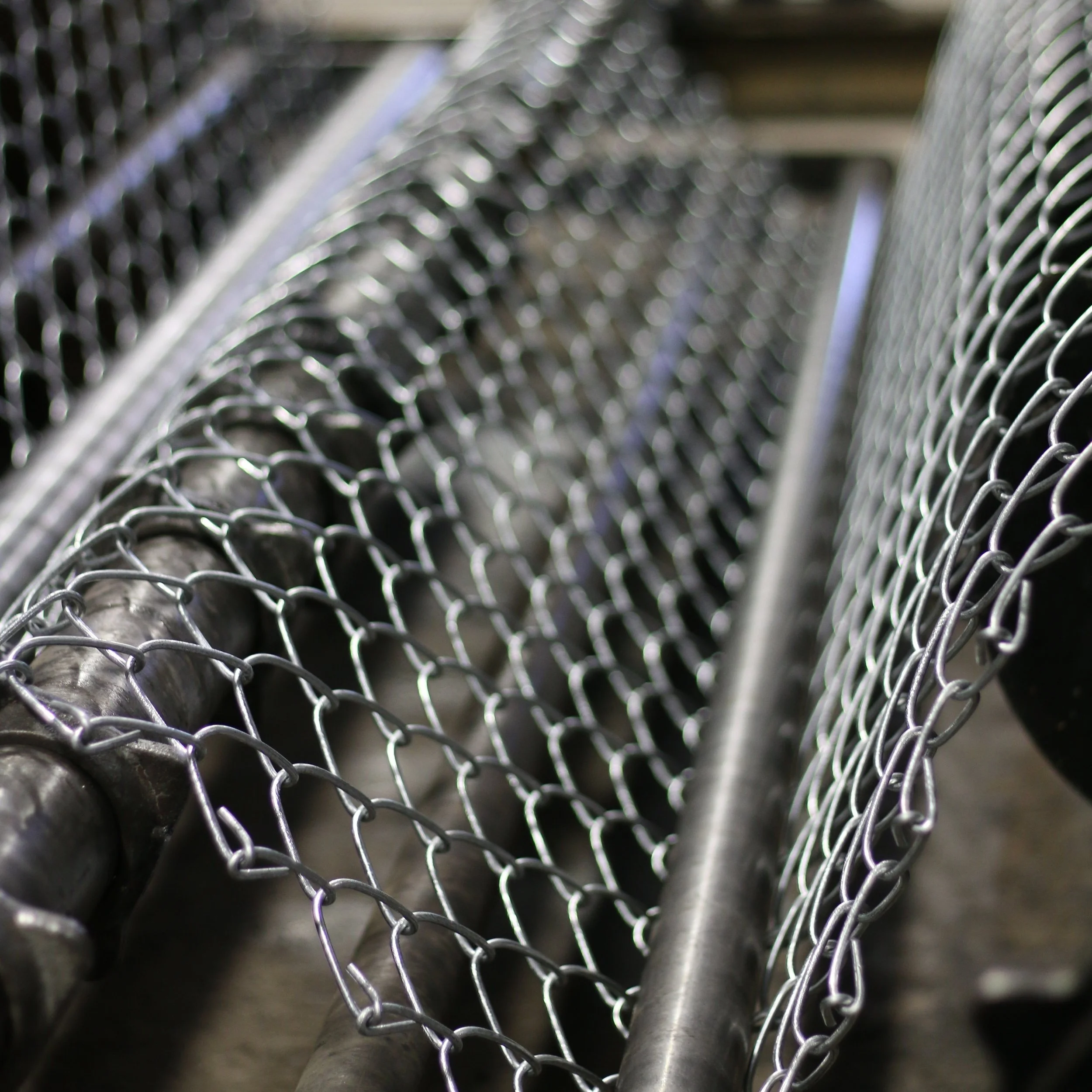 Image of a chain-link weaving machine at Eagle Custom Gate and Fence in Warrior Alabama
