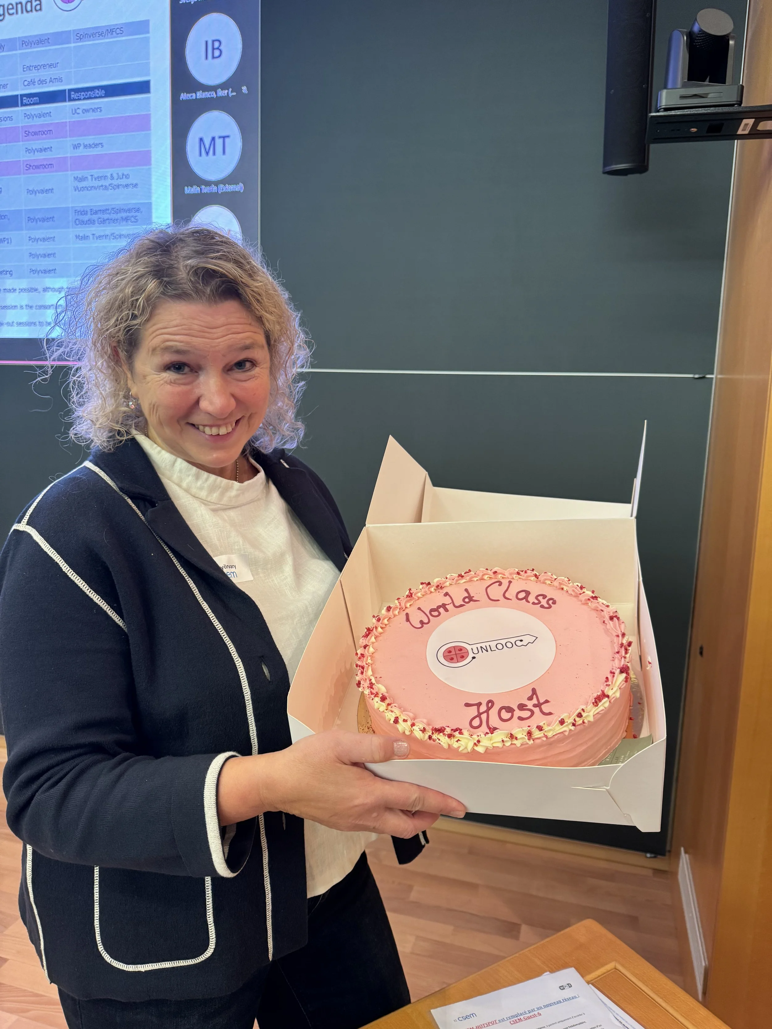 Host E Gyorvary with cake.jpeg