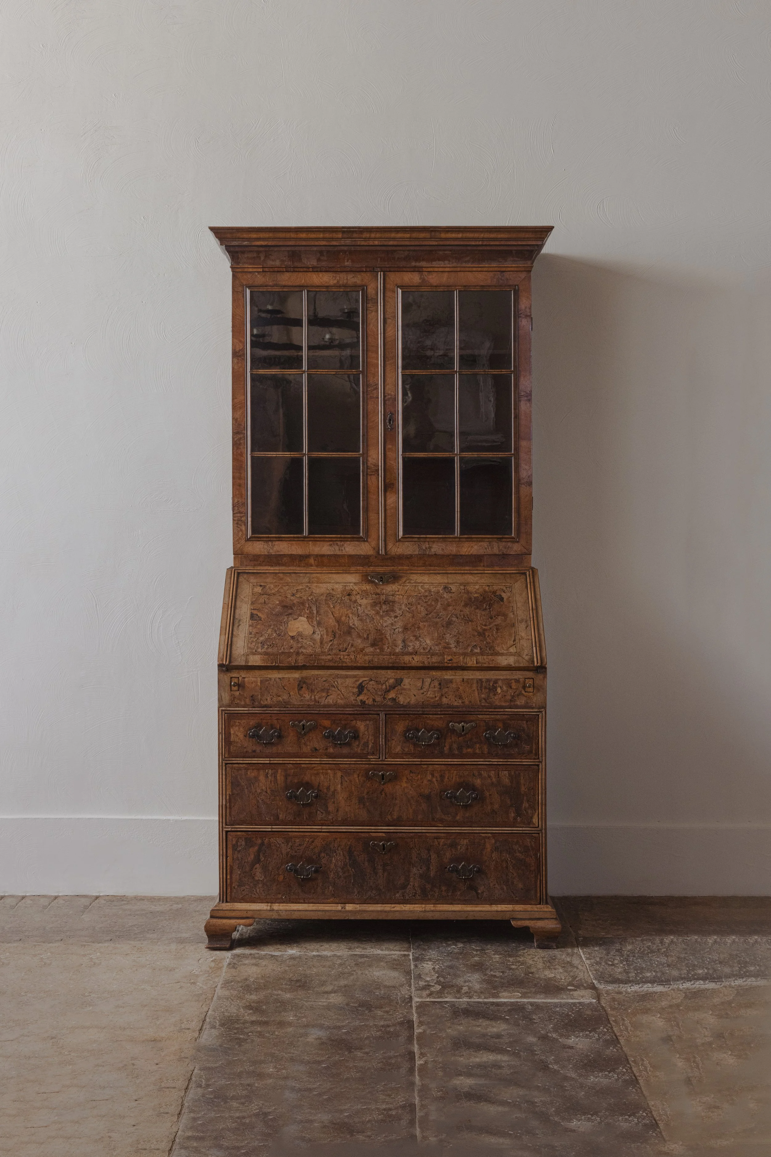 A Georgian burr walnut bureau bookcase