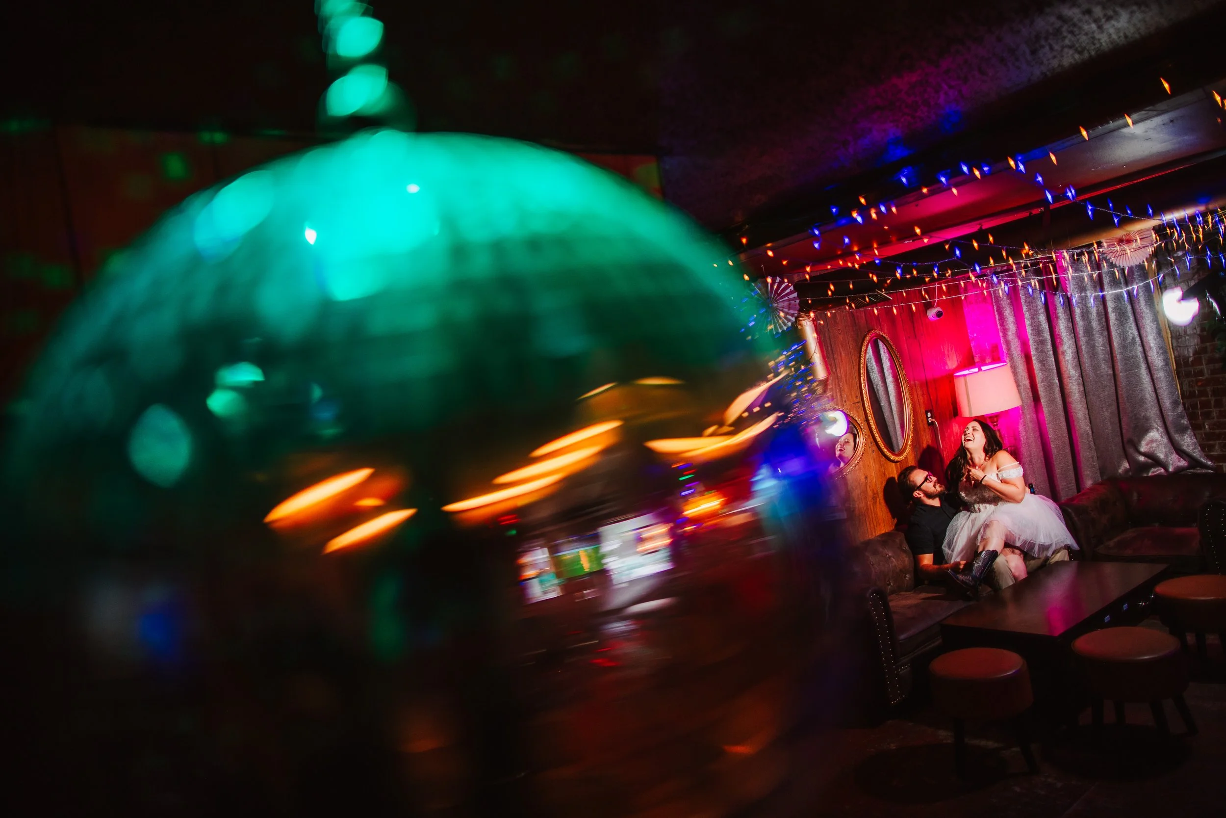 disco ball with the couple laughing