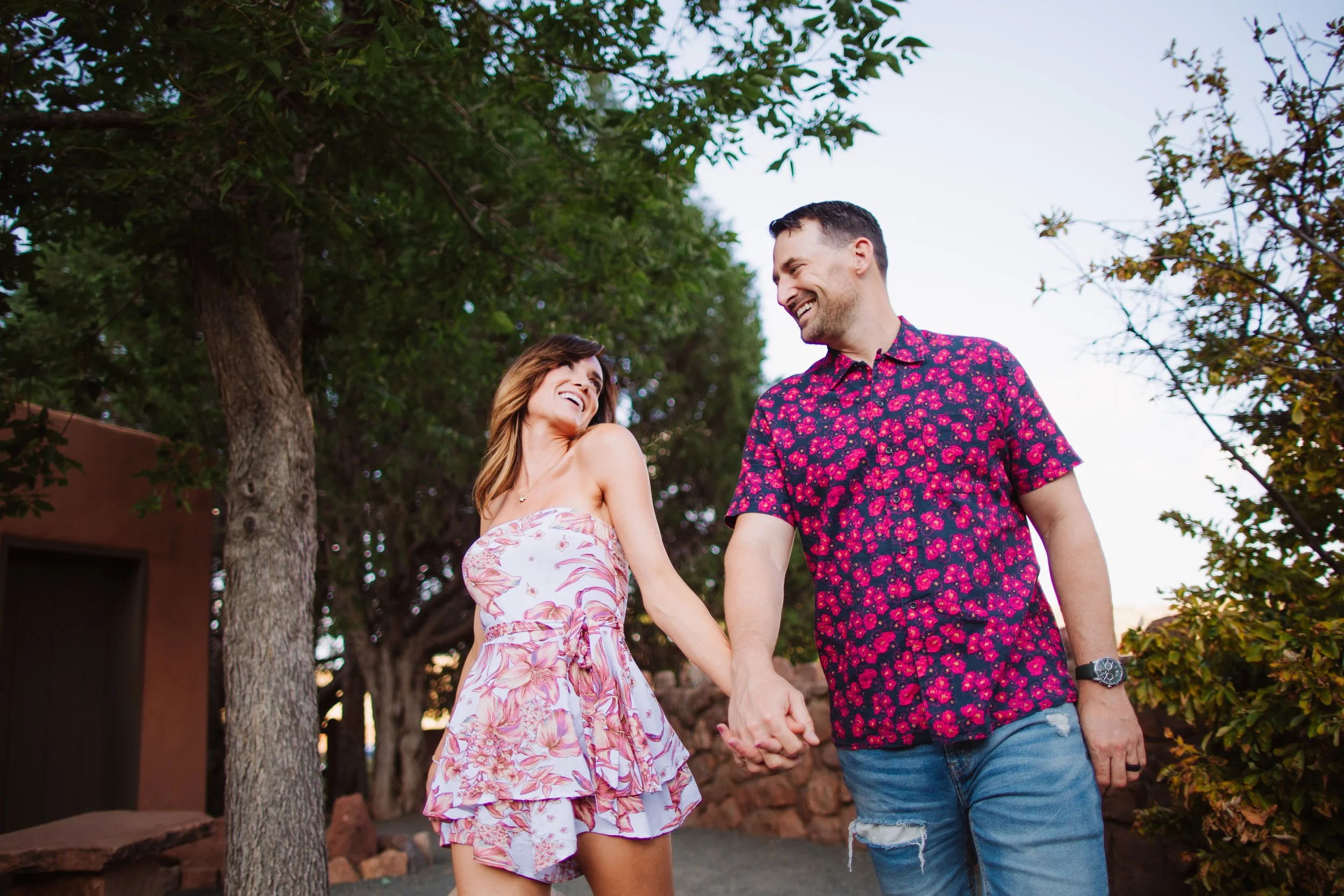 hold hands and laugh at each other 