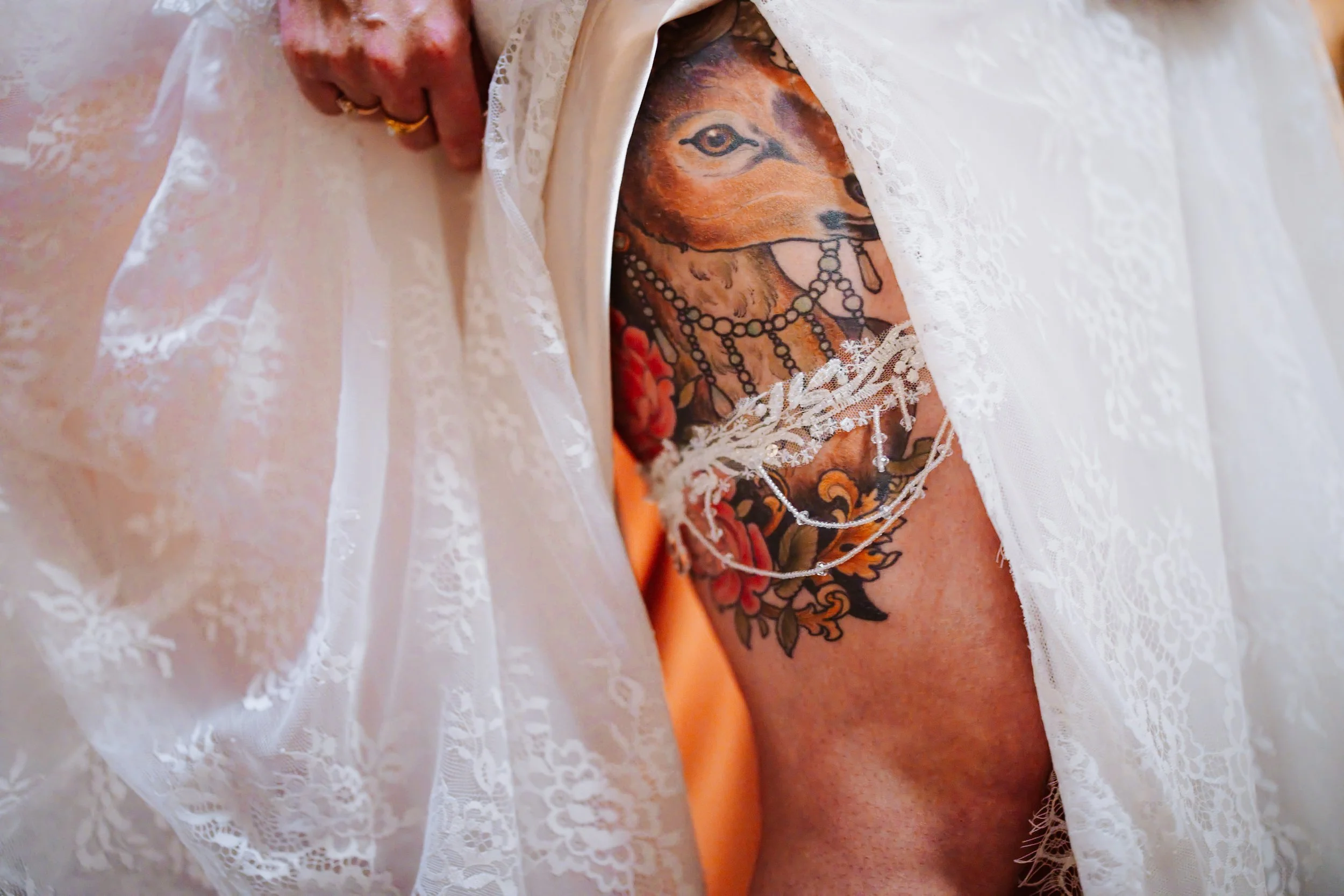 the brides tattoo on her leg 