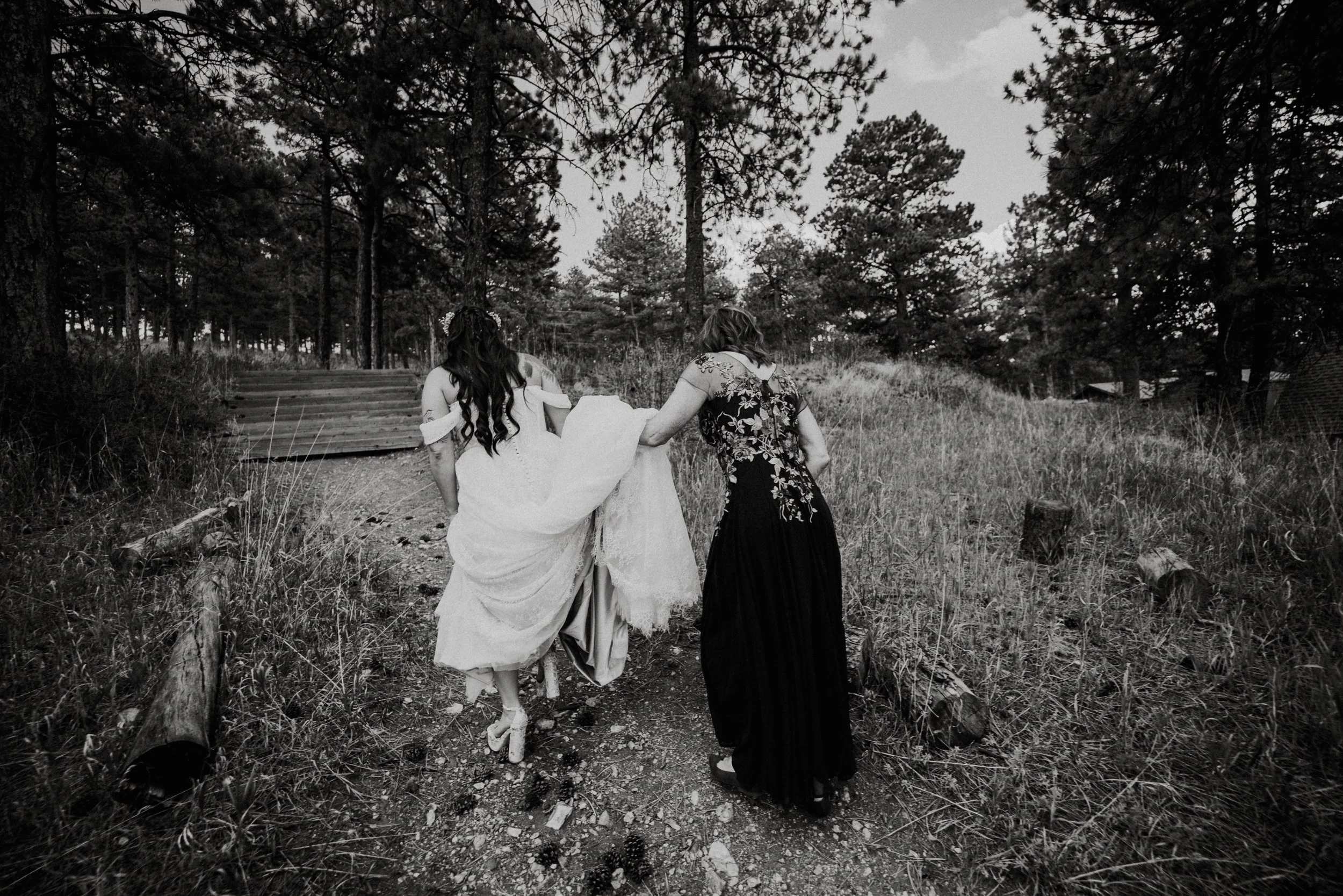 behind the scenes the bride walking with her mother 