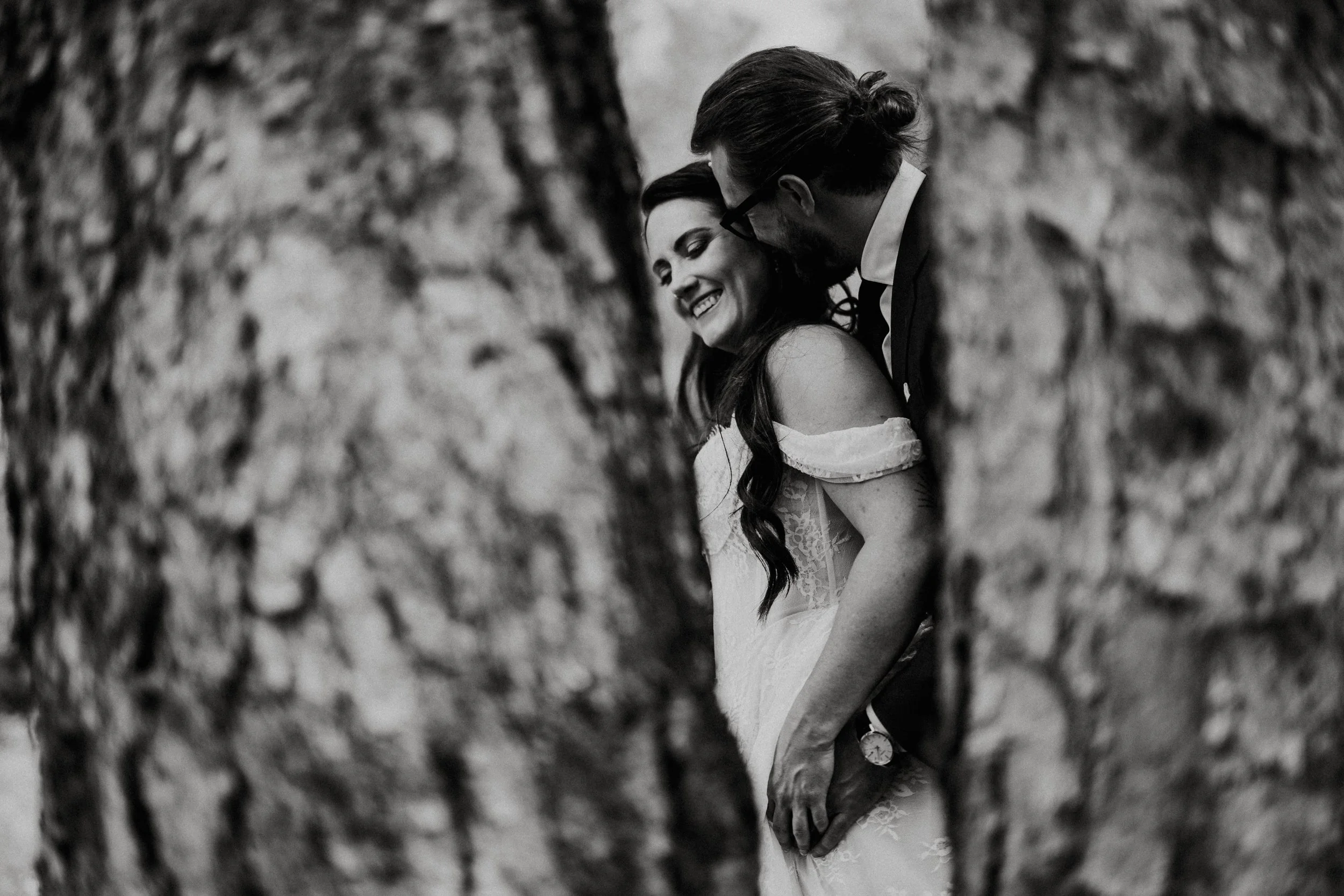 a bride and groom portrait in the trees 