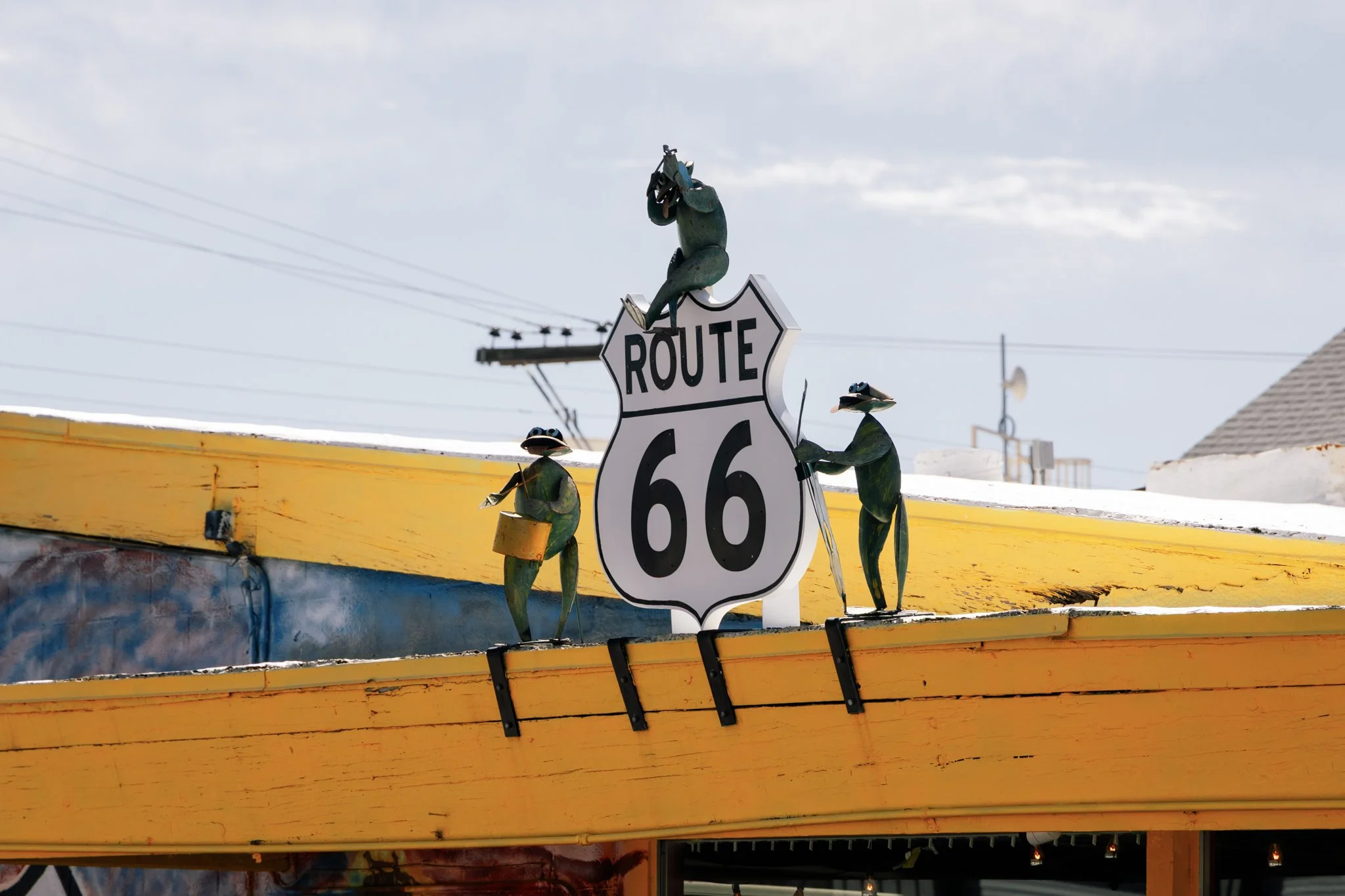 Route 66 Sign with Alien Band Sculptures