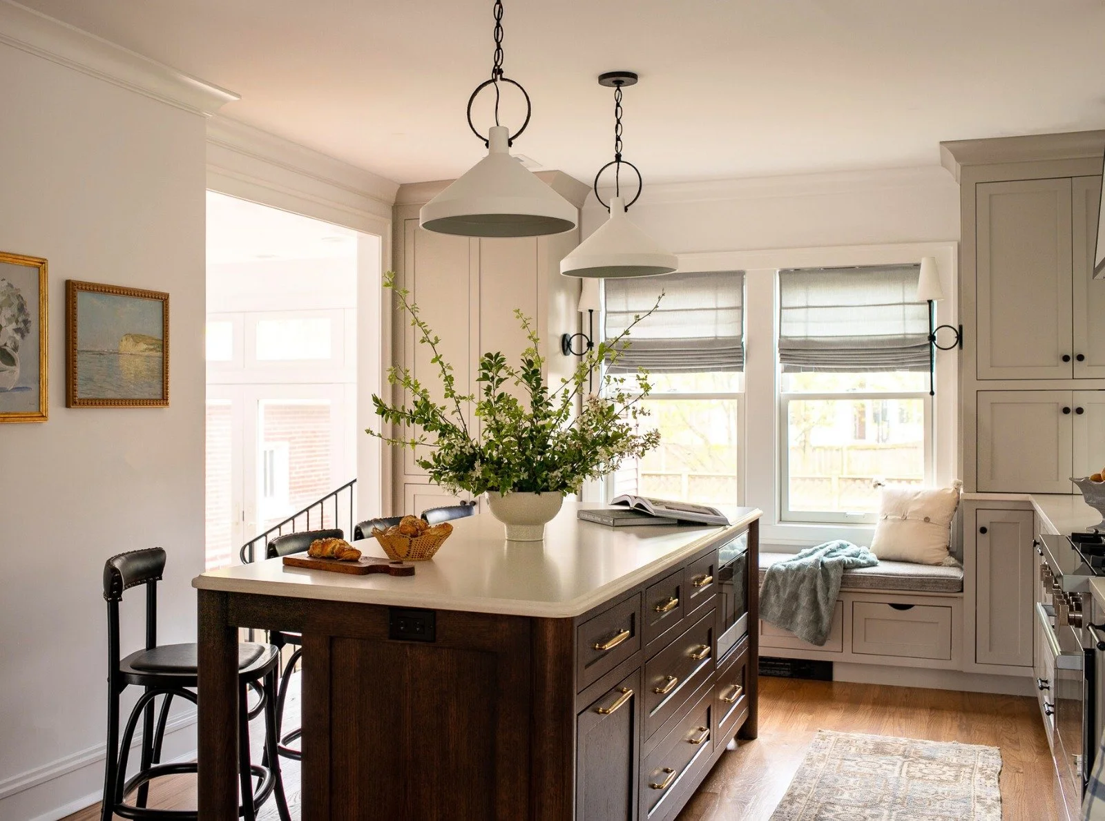 This Evanston kitchen remodel is all about light, flow and family time. After all, so much of our daily lives happen in the kitchen!

We widened the entrances to the space to open it up to the rest of the house and created symmetry by centering the c