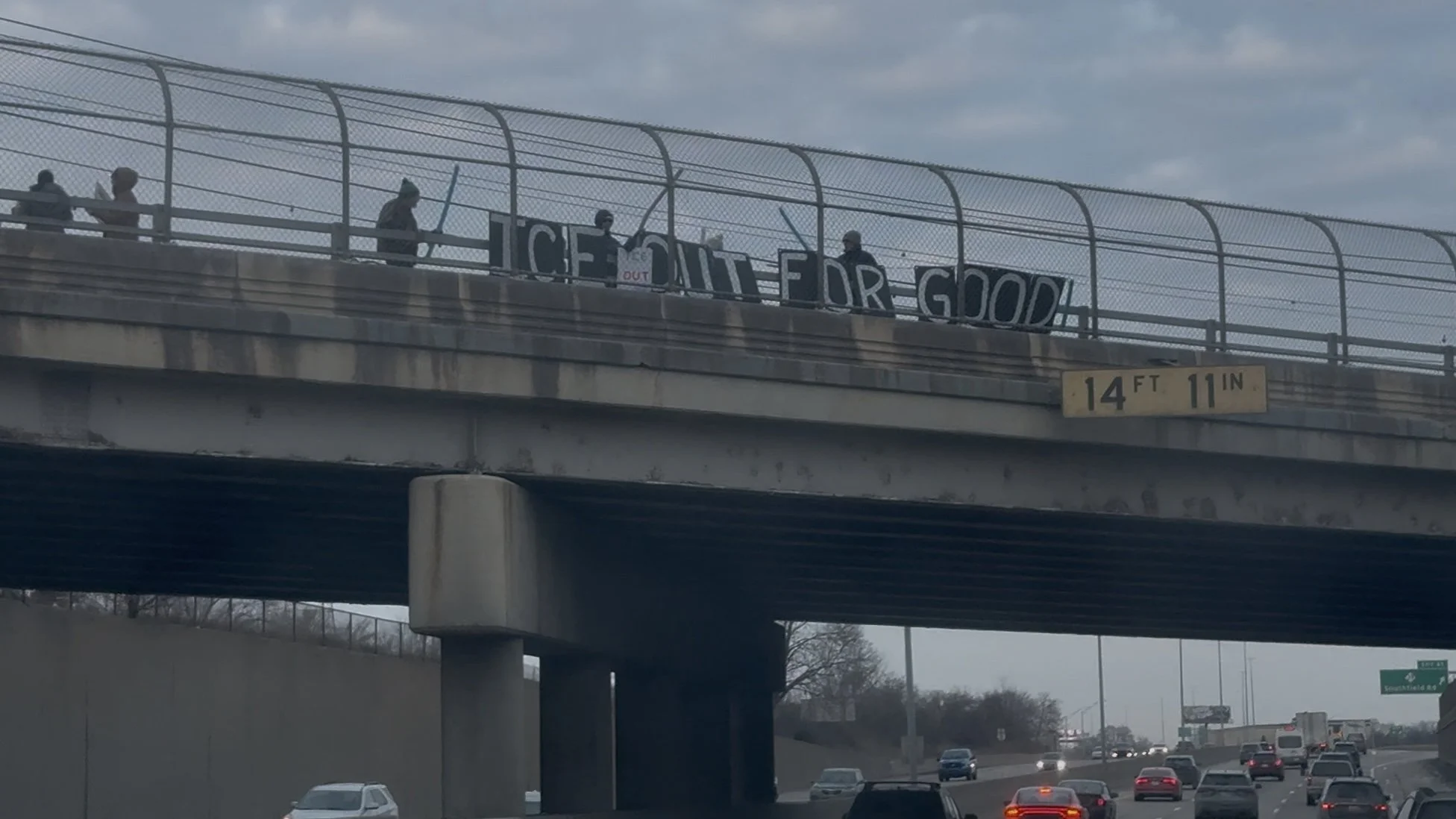 Protesters Take to Overpass Above I-75 in Lincoln Park, Michigan in Opposition to ICE
